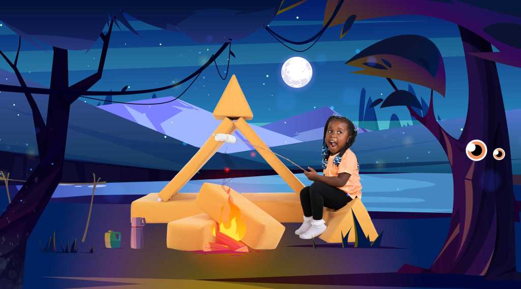 Image of a girl pretending to toast marshmallows on a camp fire using sofa cushions to make a play tent. Loft 25 LTD "The Zonky" Play Sofa Camping theme affiliated with SpookyMrsGreen.com mindful parenting and modern pagan lifestyle blog.